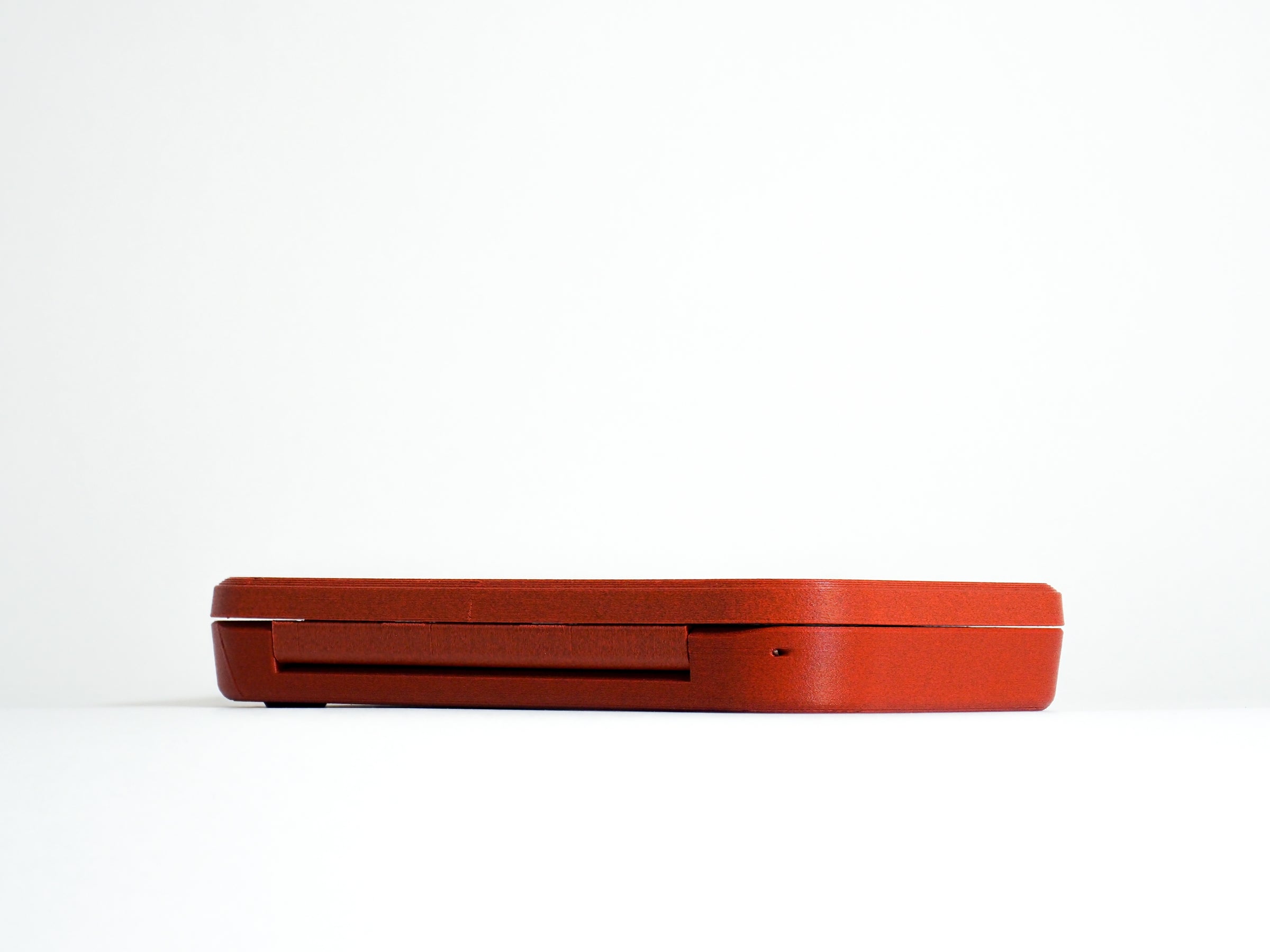 


    
Multi Lens Case in Clay Red color option
  
